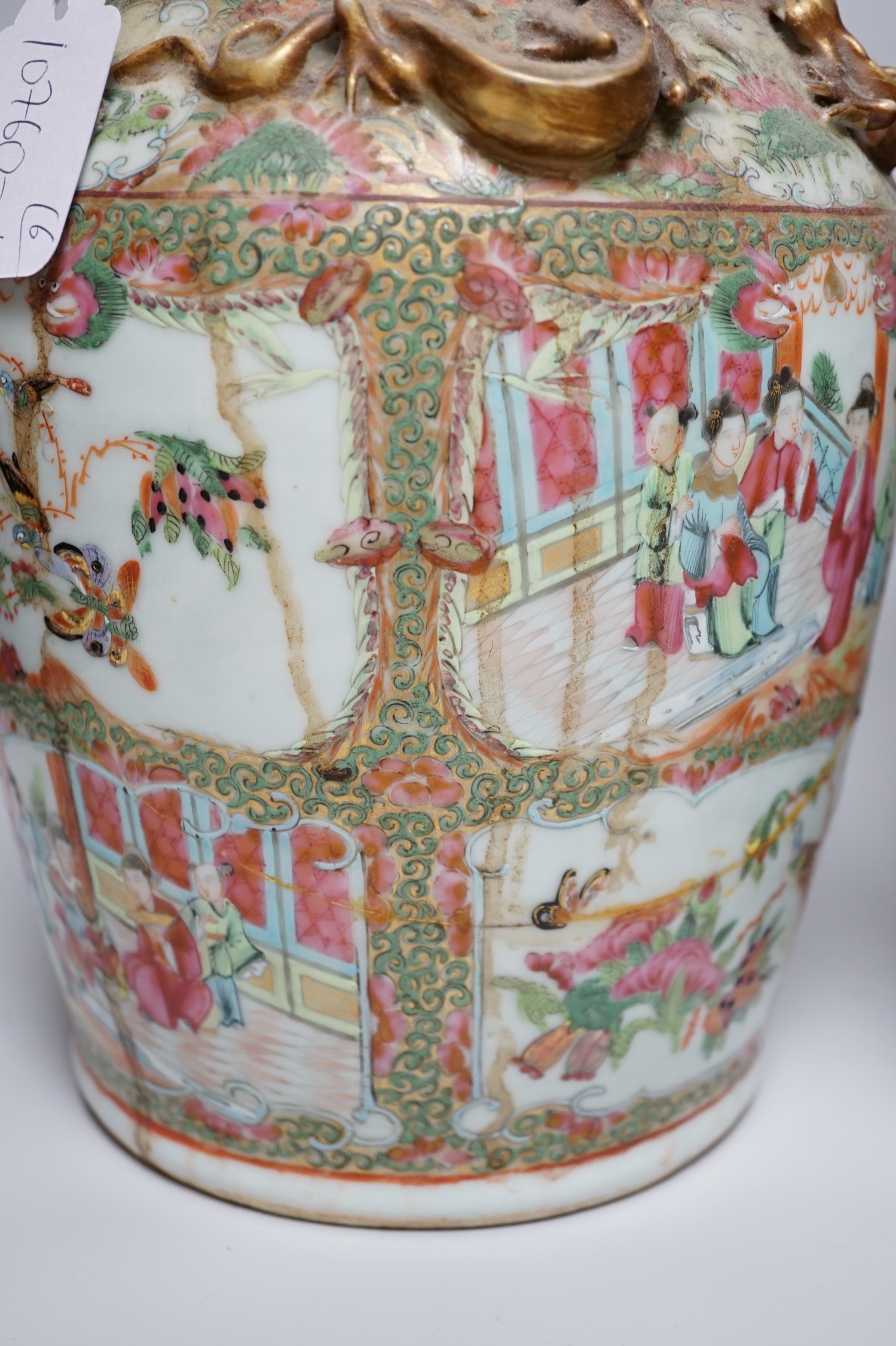 A pair of Chinese Canton decorated famille rose enamelled vases, 36cm high, an early 20th century Chinese blue and white baluster vase, 25cm (a.f.), a 19th century Chinese blue and white gu shaped vase, 37.5cm (a.f.), a